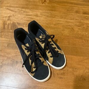 Black and Gold Nike Sneakers